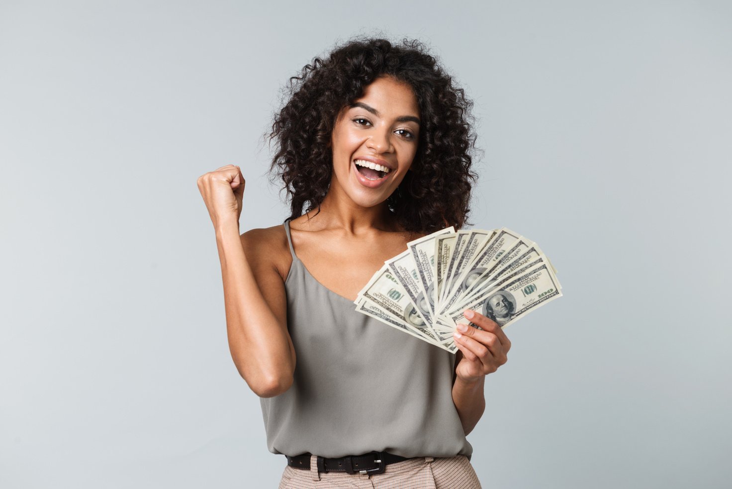 Happy Young Woman Holding Cash